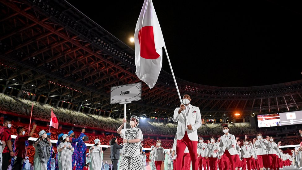 Flag bearers Yui Susaki and Rui Hachimura of Team Japan lead their team out during the Opening Ceremony of the Tokyo 2020 Olympic Games at Olympic Stadium on July 23, 2021 in Tokyo, Japan.