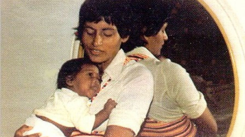 João Ernesto Van Dunem as a baby in 1977 being held by his mother Sita Valles