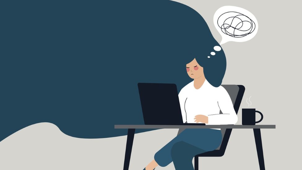 An illustration of a woman sat at a computer looking stressed