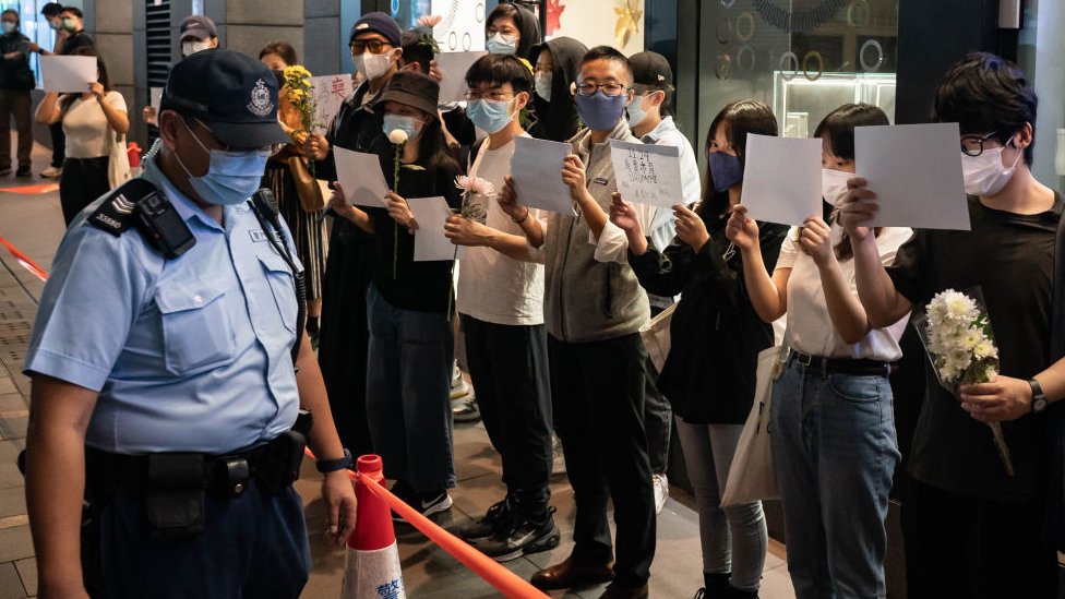 Manifestantes protestan las medidas anticovid de China.