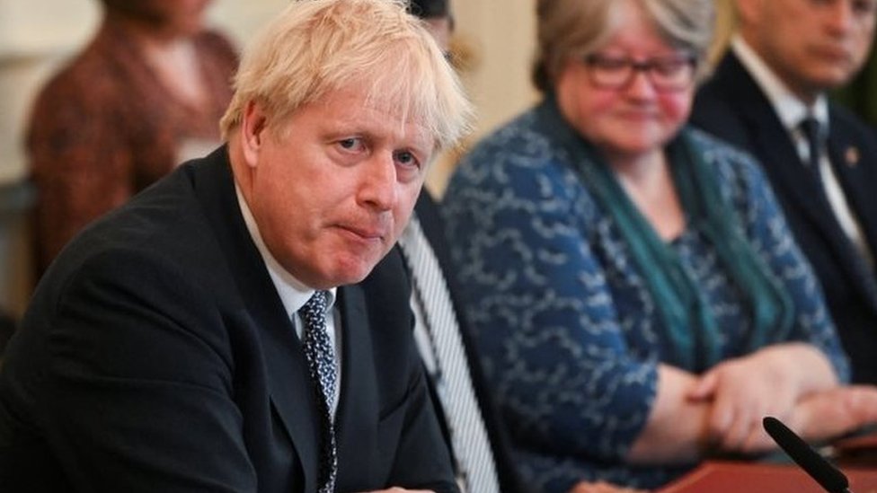 Boris Johnson fights for political survival as cabinet ministers quit