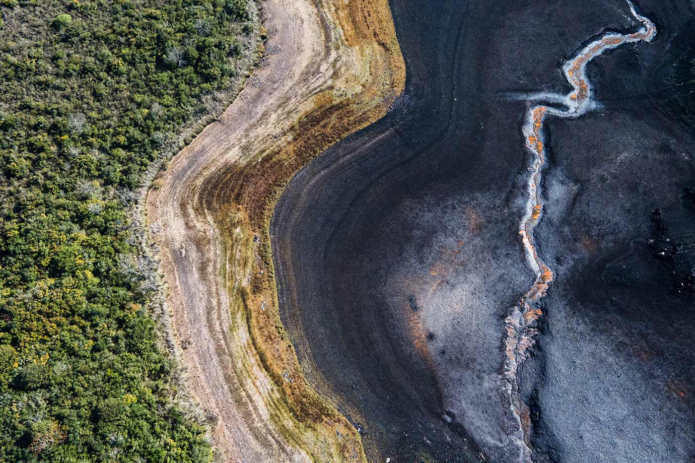 ​​Aerial view of a dry section of the Santa Lucia river at Uruguay’s Paso Severino reservoir 1 July 2023