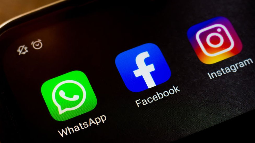 In this photo illustration a WhatsApp, Facebook and Instagram app seen displayed on a smartphone.