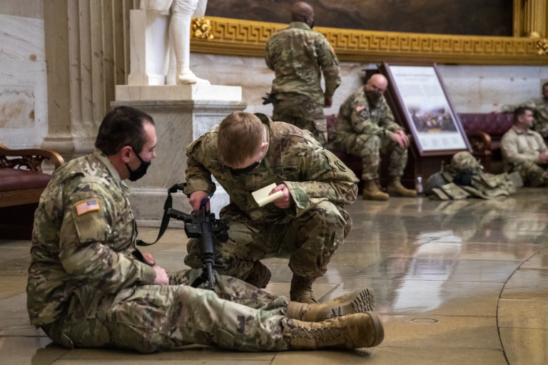 US National Guard soldiers taking a break inside the US Capitol in Washington