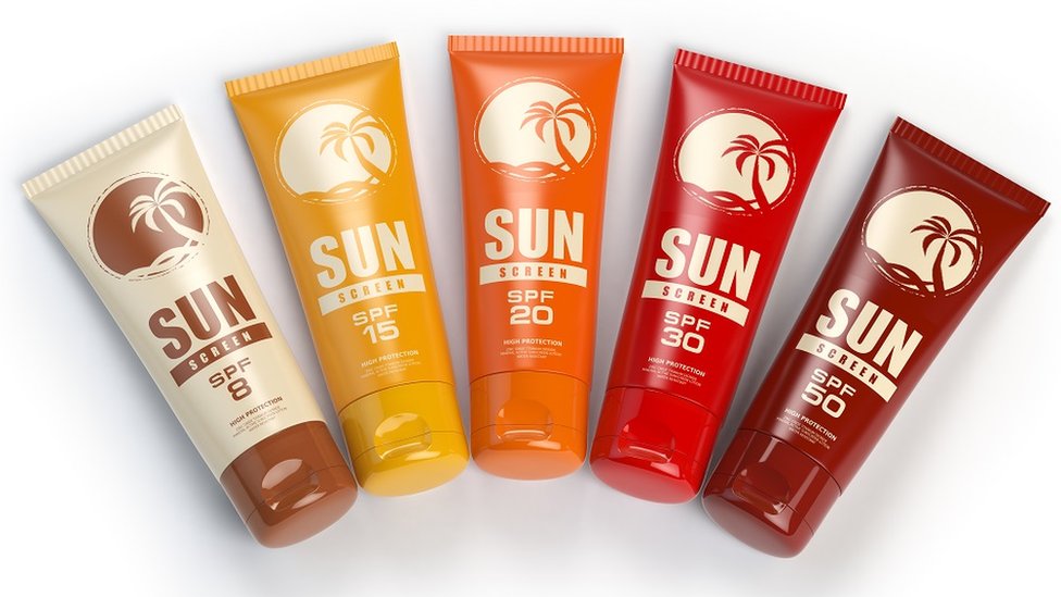 Sunscreen containers with different spf, on a white background, displayed as a fan