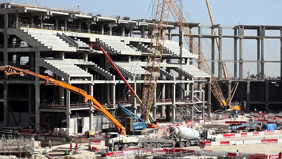 A wide shot of a the construction of a stadium in Qatar