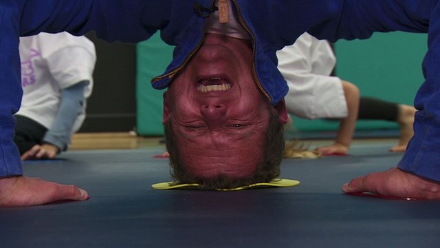 Mike Bushell doing a headstand