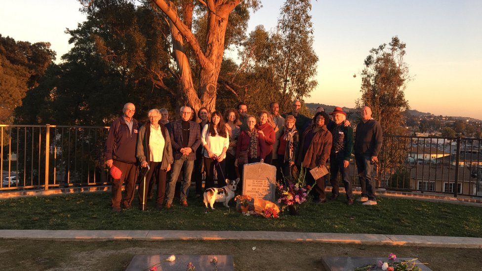 Survivors gather at Evergreen Cemetery in Oakland