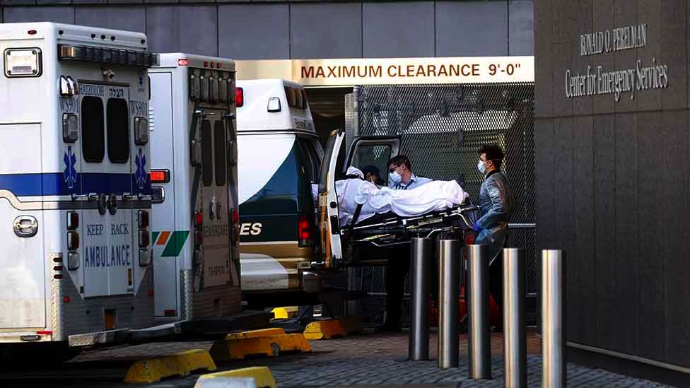 An ambulance delivers a patient to a hospital