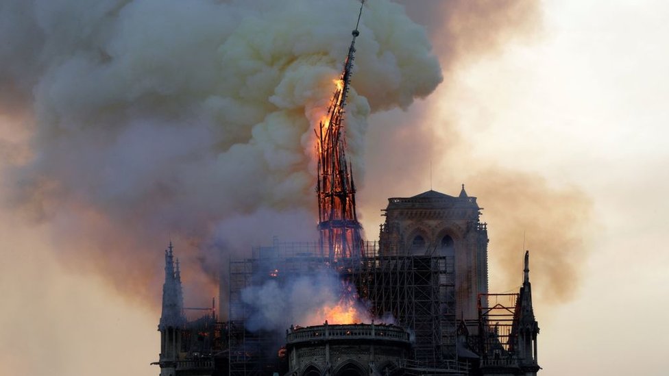 Notre Dame spire on fire in April 2019