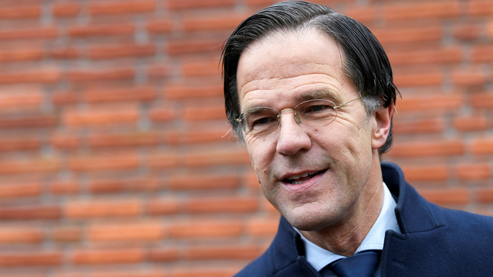 Dutch election: Exit polls indicate win for Mark Rutte