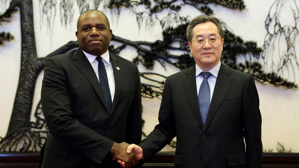 Britain's Foreign Secretary David Lammy and Chinese Vice Premier Ding Xuexiang shake hands before their meeting at the Great Hall of the People in Beijing, China October 18, 2024.