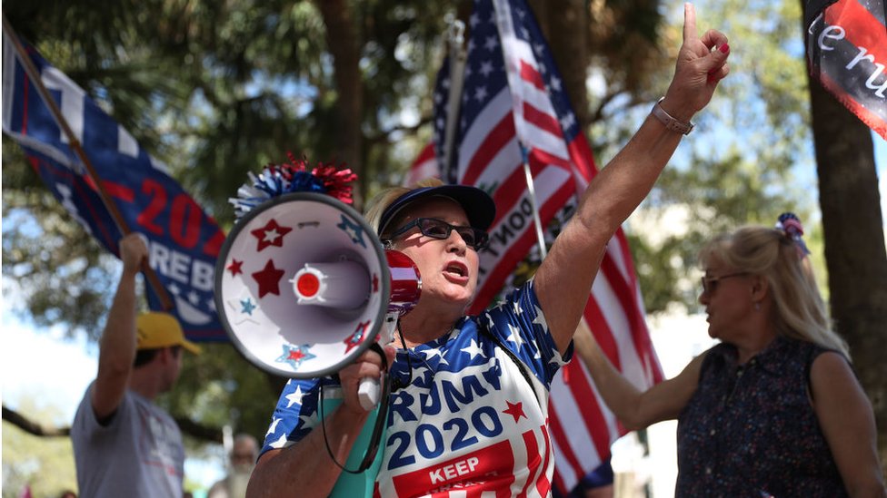 Supporters of Donald Trump outside the Hyatt Regency Hotel in Orlando