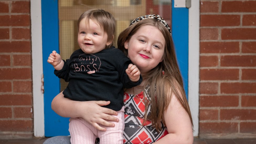 Annabelle and Jasmine-Rose on the doorstep of their home in Nottingham