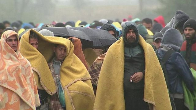 Migrants wrapped in blankets