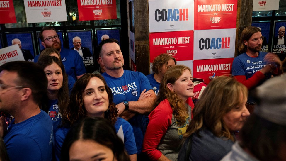 Alumni of Mankato West High School, where Democratic vice presidential nominee Minnesota Governor Tim Walz formerly taught, watch the Vice Presidential debate between Walz and Republican vice presidential nominee U.S. Senator J.D. Vance (R-OH) at a watch party event coordinated by the state Democratic party and the Harris-Walz campaign in St. Paul, Minnesota, U.S., October 1, 2024