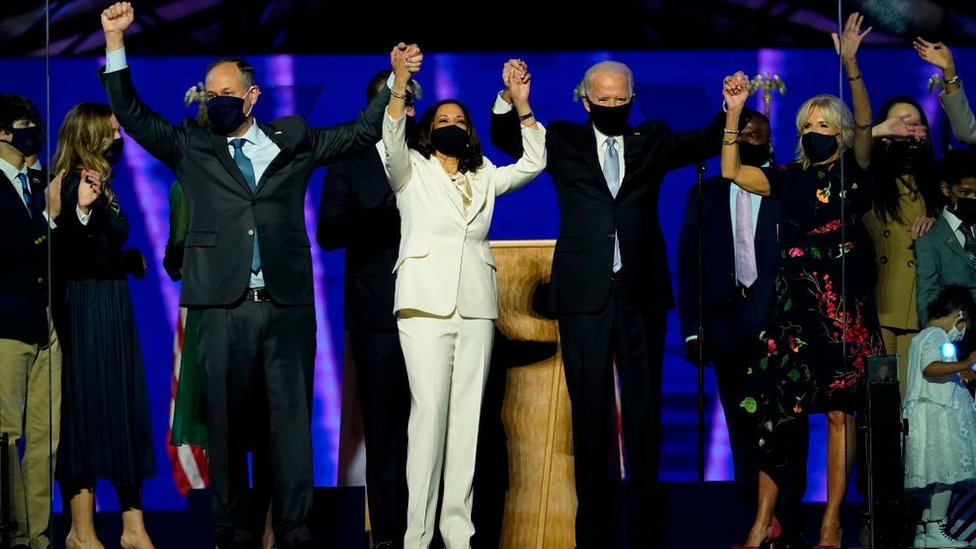 President-elect Joe Biden and Vice President-elect Kamala Harris, stand with their spouses, Dr. Jill Biden and Douglas Emhoff, after addressing the nation from the Chase Center November 07, 2020 in Wilmington, Delaware - GETTY IMAGES