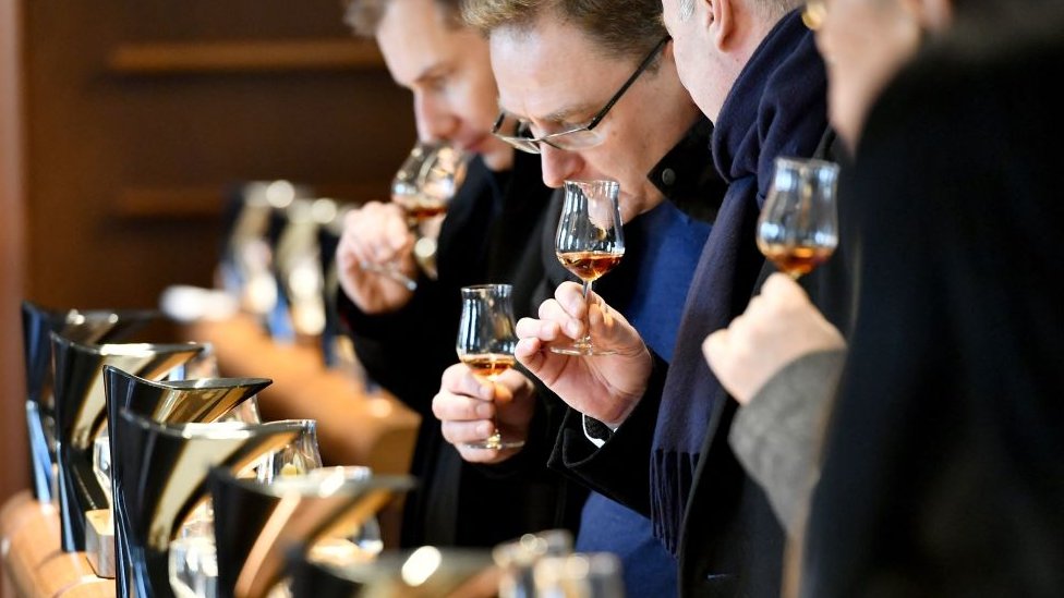 February 9, 2018, visitors attend a tasting lesson with different samples of Cognac in Hennessy's tasting room in Cognac, southwestern France, during an oenotourism guided tour