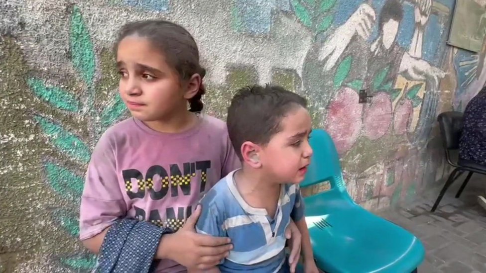 Crying children outside a Gaza hospital