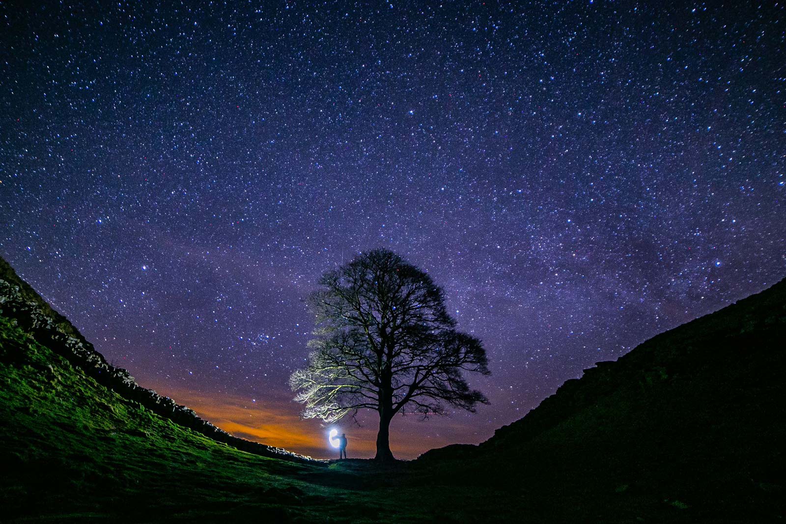 A photograph taken by Kris Hodgetts at Sycamore Gap at nighttime in 2019