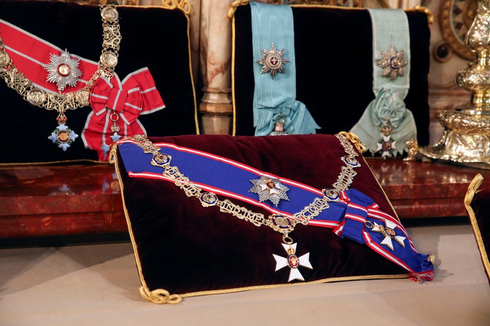 Insignia belonging to Prince Philip, the Royal Victorian Order Collar and Badge, and the Royal Victorian Order Breast Star and Badge (front) and The Order of the Elephant (Denmark), and the Order of the Redeemer (Greece), are placed on the altar in St George's Chapel, Windsor