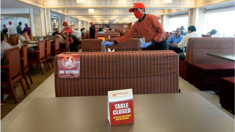 A waiter works inside a restaurant