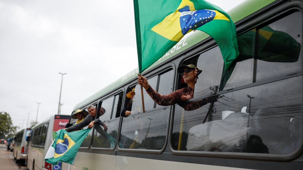Bus with Bolsonaro supporters and Brazil's flags