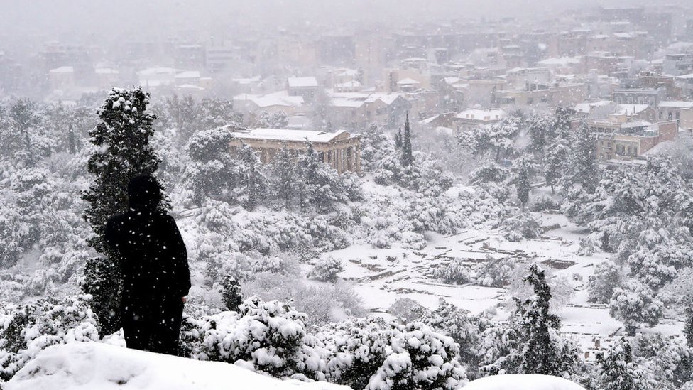 Ancient Agora archaeological site during a heavy snowfall in Athens