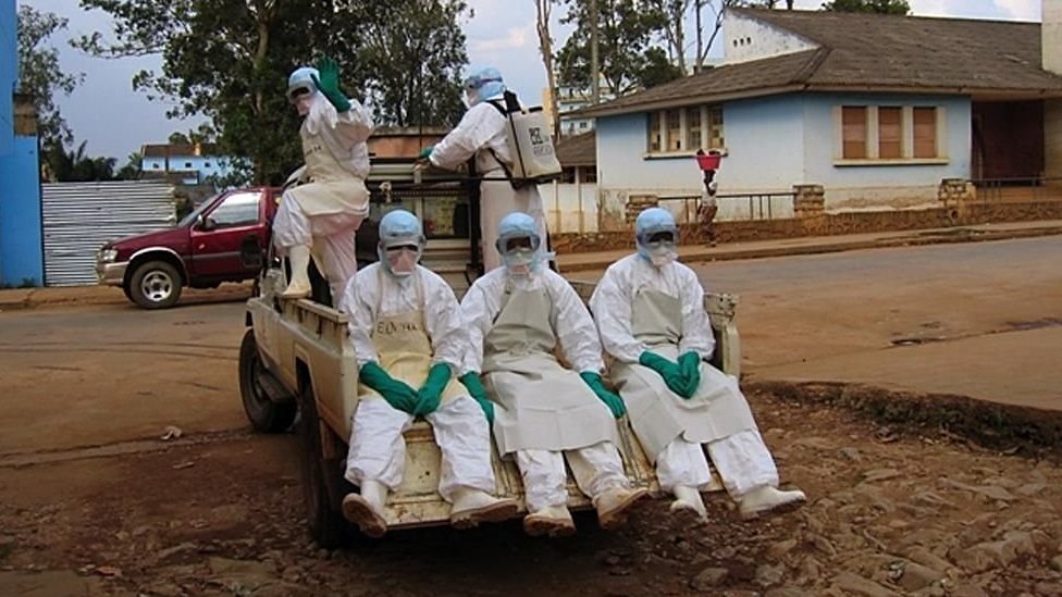 Personnel in hazard suits