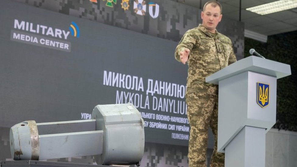 Ukrainian military official Mykola Danyliuk points at a briefing in Kyiv to what he says is a dud warhead of Russia's X-55 cruise missile found in western Ukraine. Photo: 1 December 2022