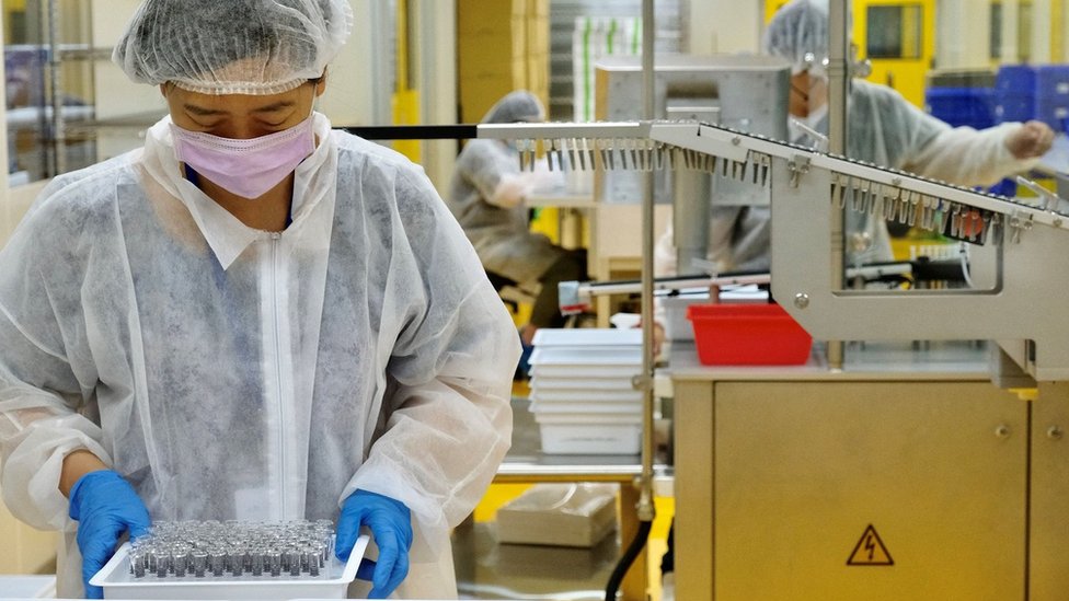 Medical staffers from Taiwans vaccine maker Medigen Vaccine Biologics Crop (MVC) work at a lab in Hsinchu on June 17, 2021