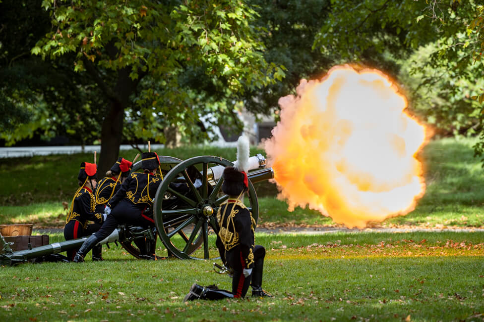 The King’s Troop fire a gun from Hyde Park during the procession