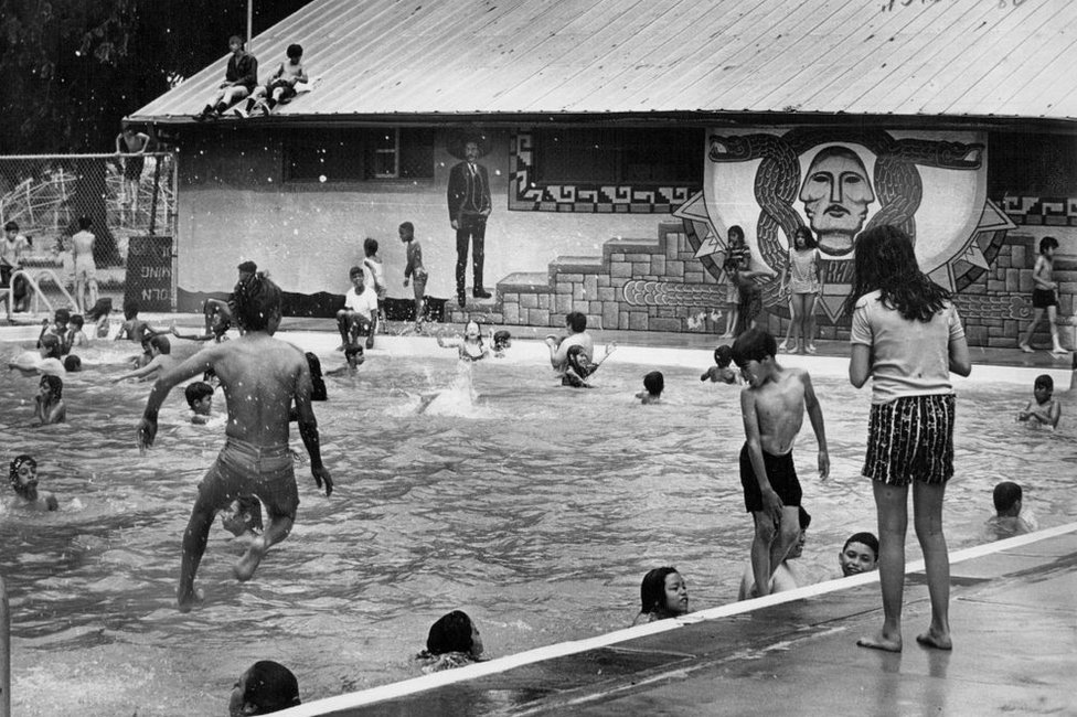 Latino children bathe in the pool at Lincoln Park, in Denver, Colorado, on January 1, 1971.