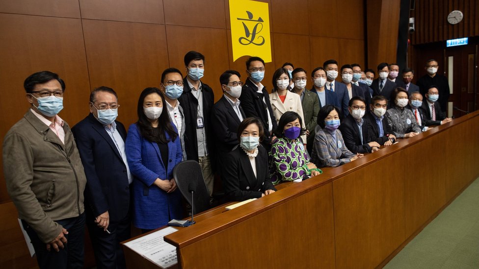 Pro-Beijing lawmakers attend a press conference at the Legislative Council in Hong Kong, China, 11 March 2021.