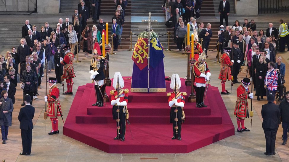 People file past the Queen's guarded coffin in Westminster Hall