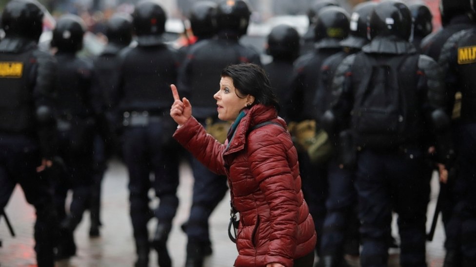A woman gestures during an opposition rally to reject the presidential election results in Minsk