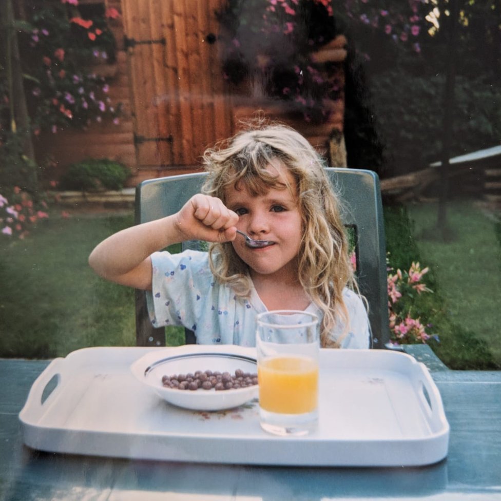 Loretta eating breakfast in her grandmother's garden