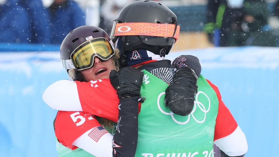 Veteran snowboarders Lindsey Jacobelli (left) and Nick Baumgartner hug to celebrate winning gold in the mixed cross event