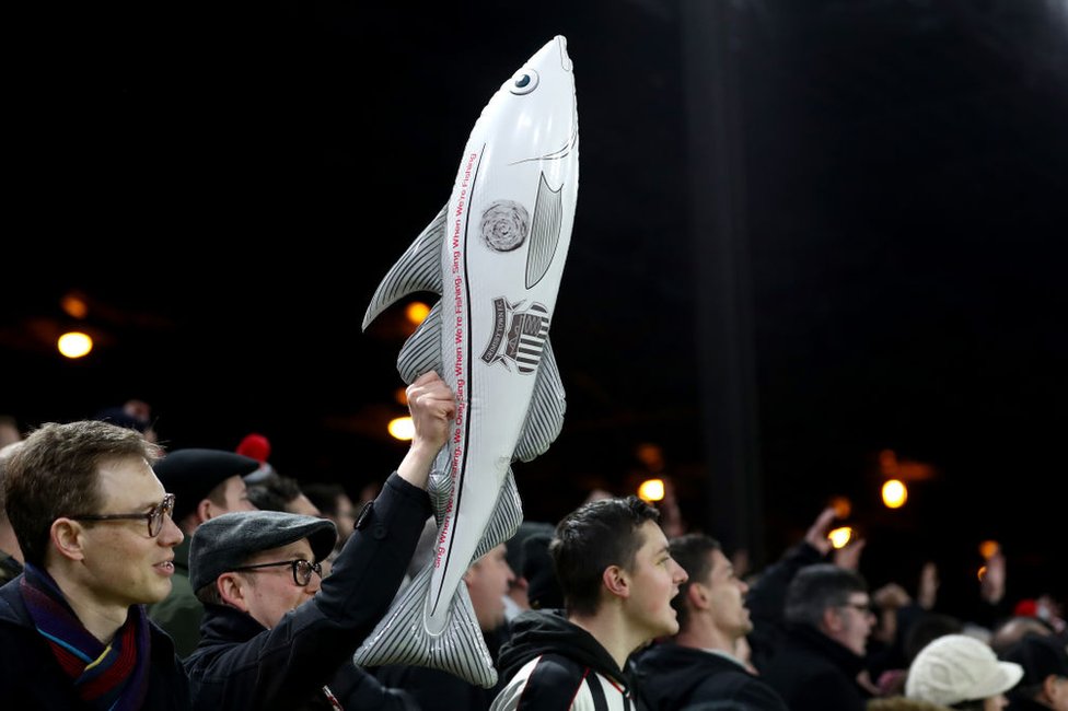 Grimsby Town supporters brandishing an inflatable fish