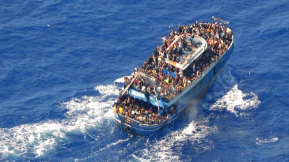A undated photo provided by the Greek coastguard shows migrants on board a boat during a rescue operation before the boat capsized on the open sea, off Greece, June 14, 2023