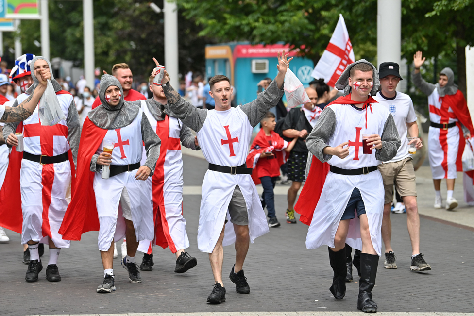 England fans dressed as knights cheer on their team outside Wembley Stadium ahead of the UEFA Euro 2020 final in London, on 11 July