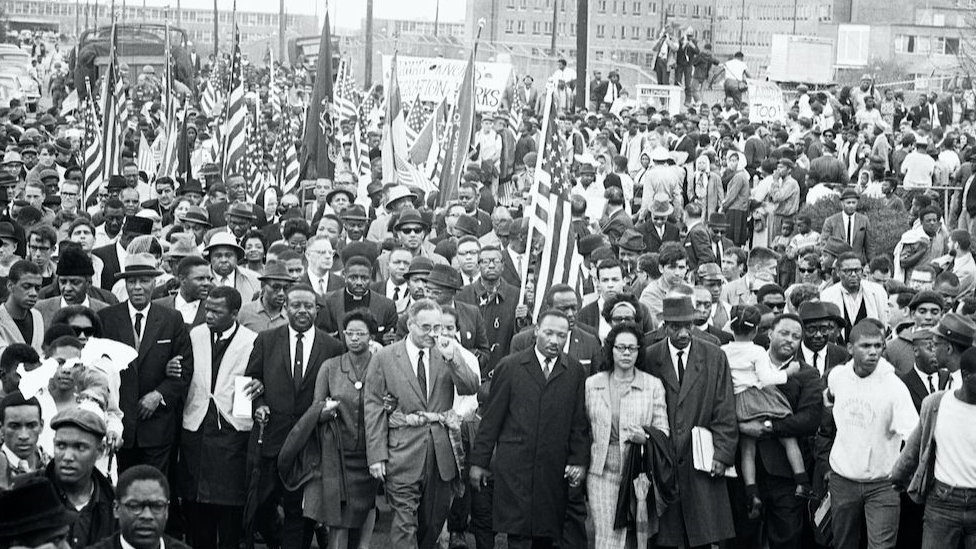 Dr Martin Luther King Jr at the front of a march by civil rights activists of several ethnicities