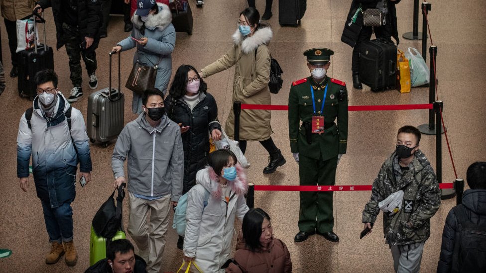 A Chinese police officer at a Beijing railway station.