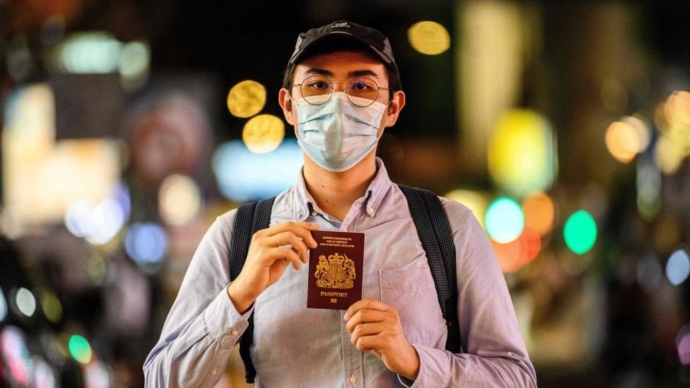 A young Hong Kong man shows his British passport