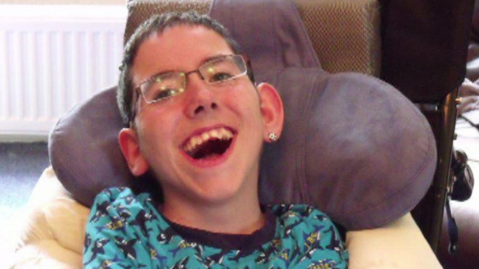 Young boy with disability laughing