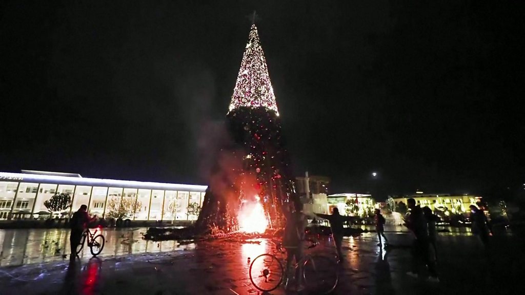 Albanian protesters burn Christmas trees over police killing