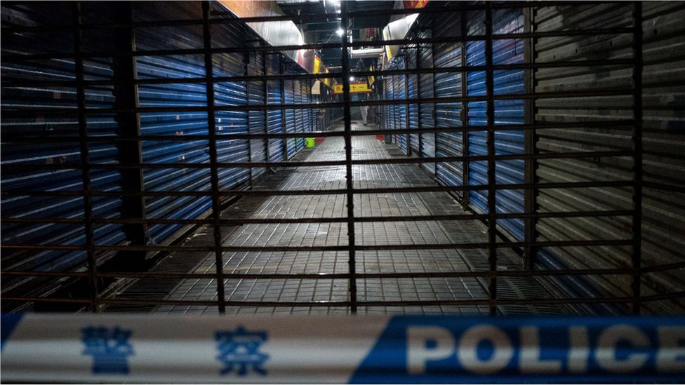 Wuhan Hygiene Emergency Response Team personnel conduct searches on the closed Huanan Seafood Wholesale Market in the city of Wuhan on 11 January 2020.