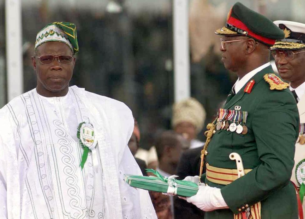 Olusegun Obasanjo standing alongside Abdulsallam Abubakar