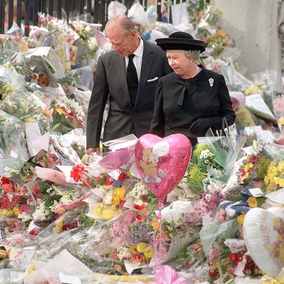 The Queen and the Duke of Edinburgh viewing the floral tributes to Diana, Princess of Wales, at Buckingham Palace