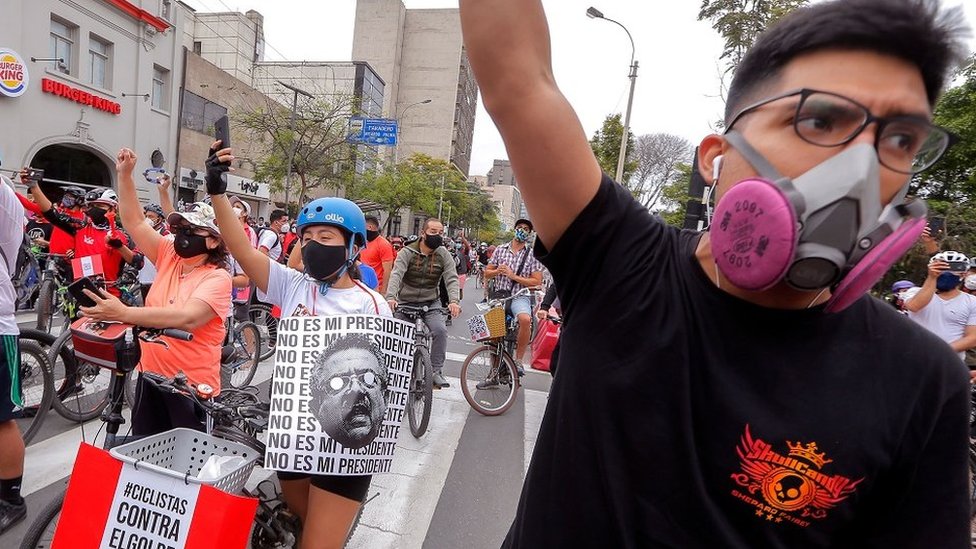 People take to the streets on bicycles to peacefully demonstrate against the new government of interim president Manuel Merino in Lima on 15 November 2020
